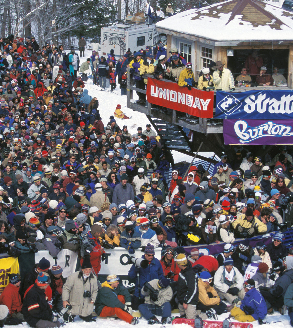 Large crowd of people in winter gear at a resort