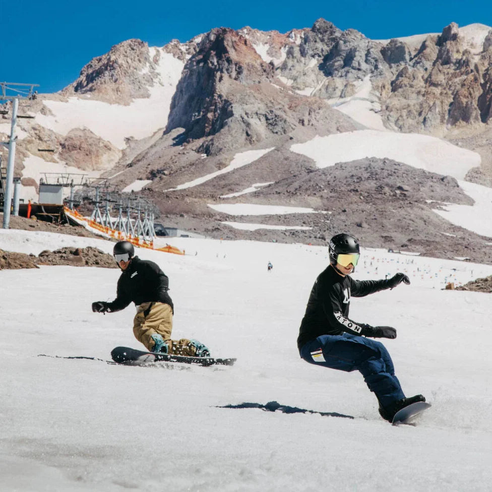 Two riders cruising down the mountain