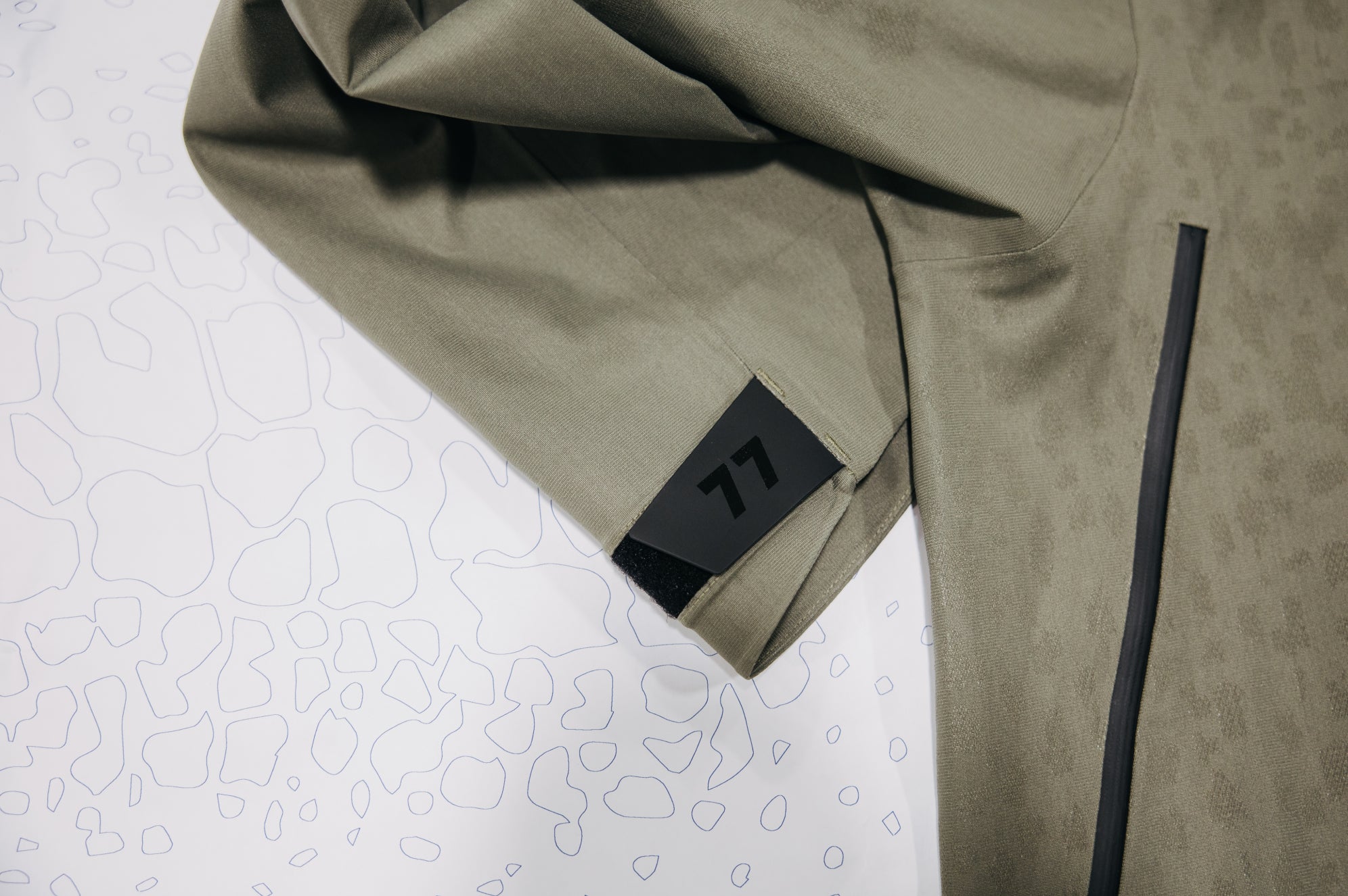 Mine 77 Jacket laid over drawing of fabric print