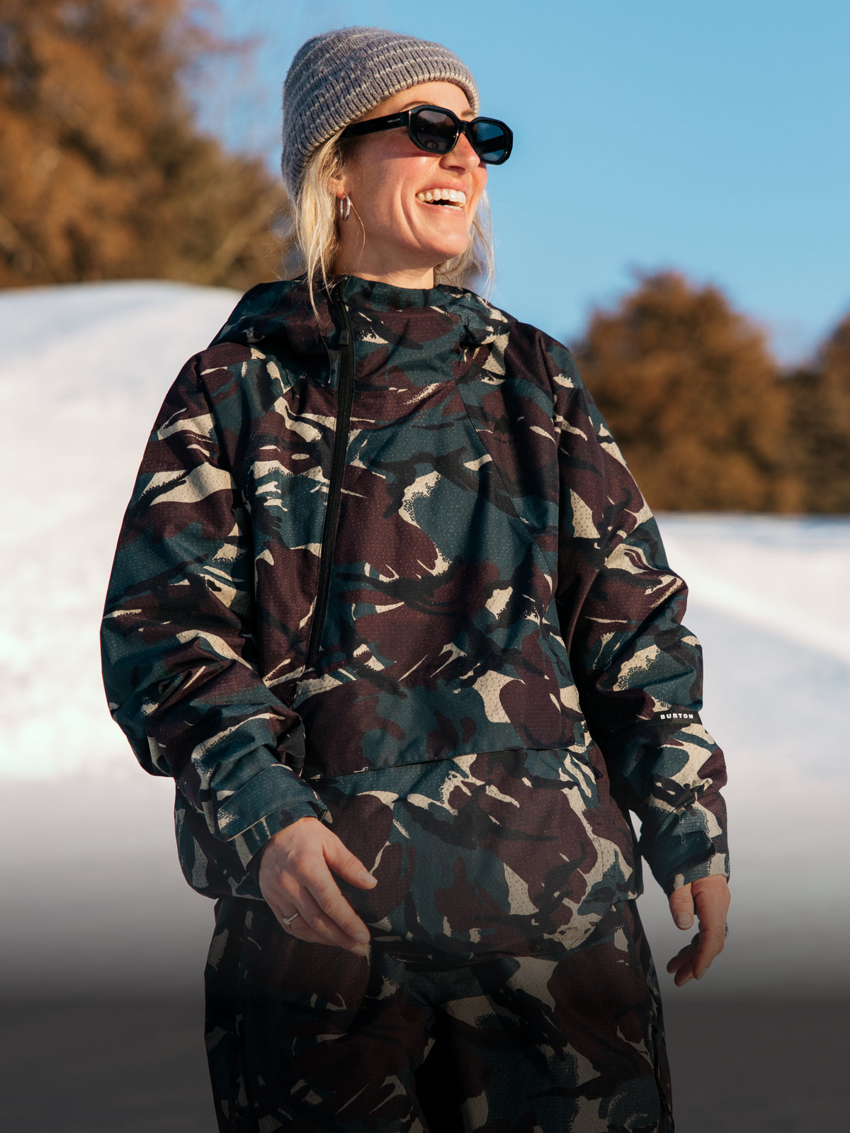 Woman wearing Reserve camo outerwear set.
