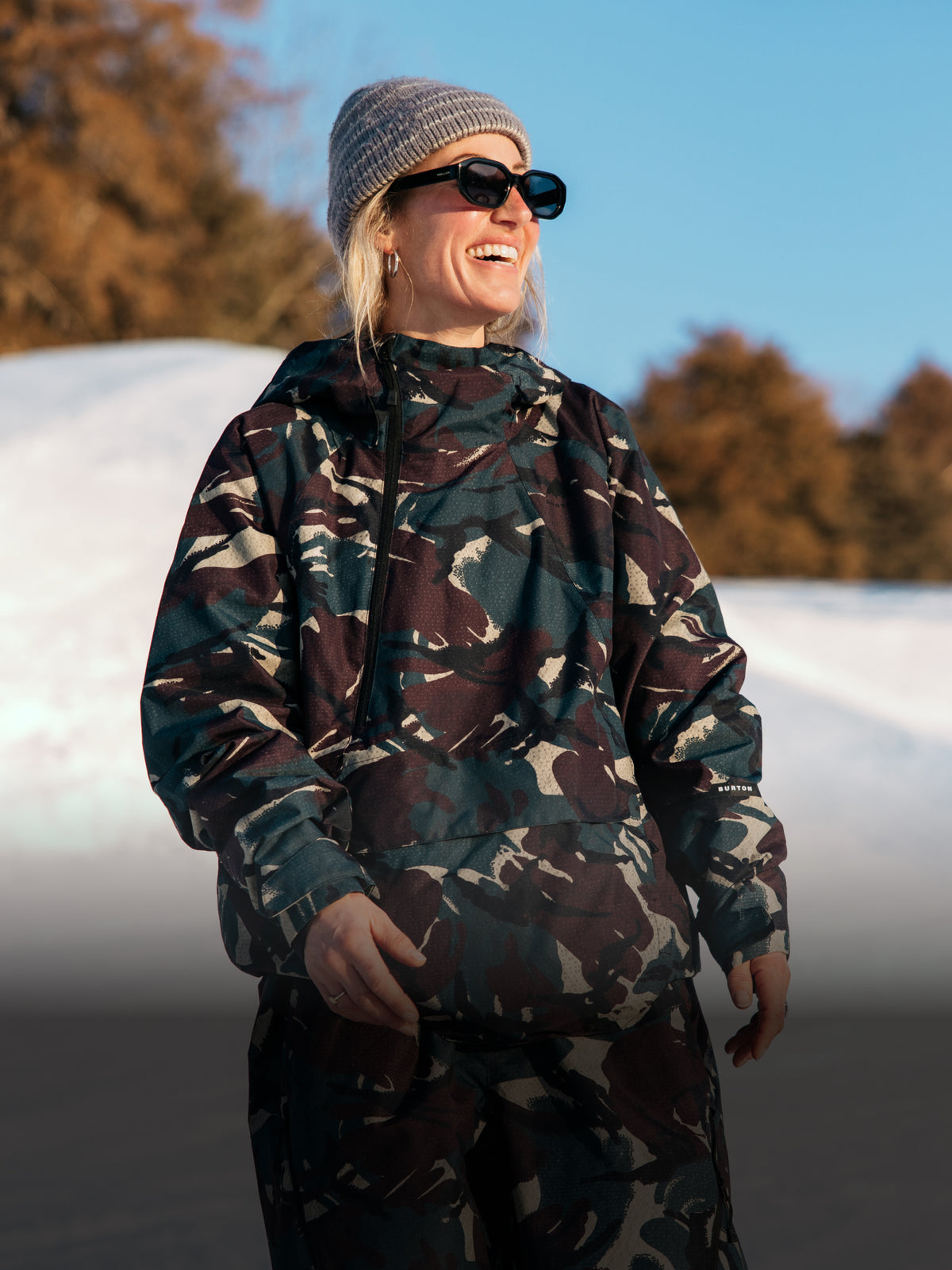 Woman wearing Reserve camo outerwear set.