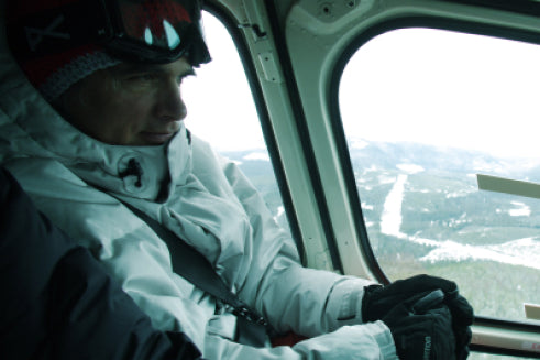 Jake in a helicopter on his way to snowboard