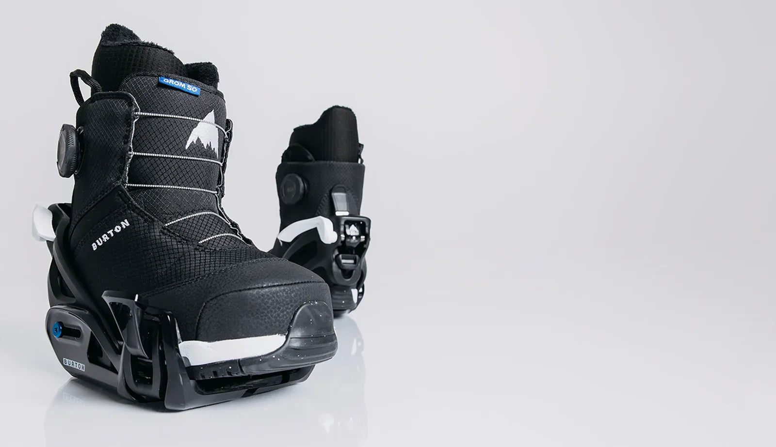Black snowboard boots with Burton logo on a light gray background